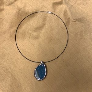 Hand crafted stone with rhinestone outline